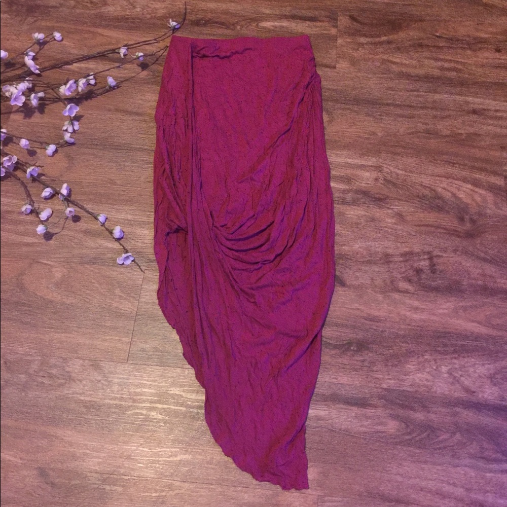 Pink asymmetrical pencil skirt.